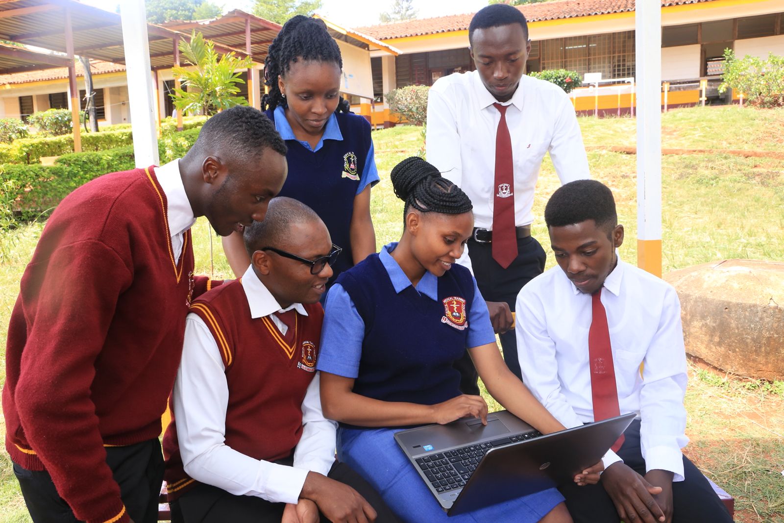 KMTC students reviewing coursework together on campus